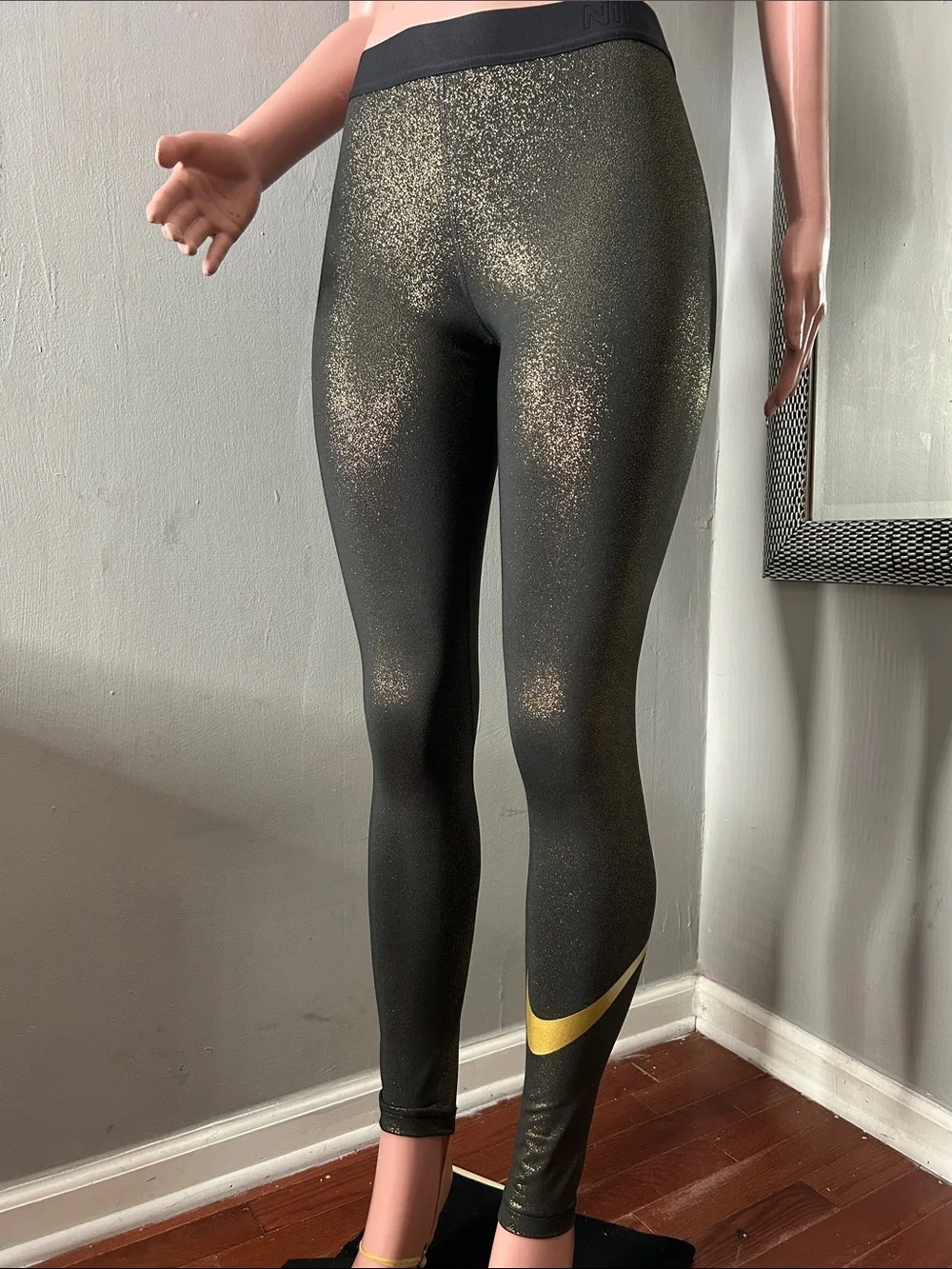 Nike Women’s Black Leggings with Gold Accent